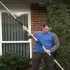 Man in gis garden assembling GutterJet